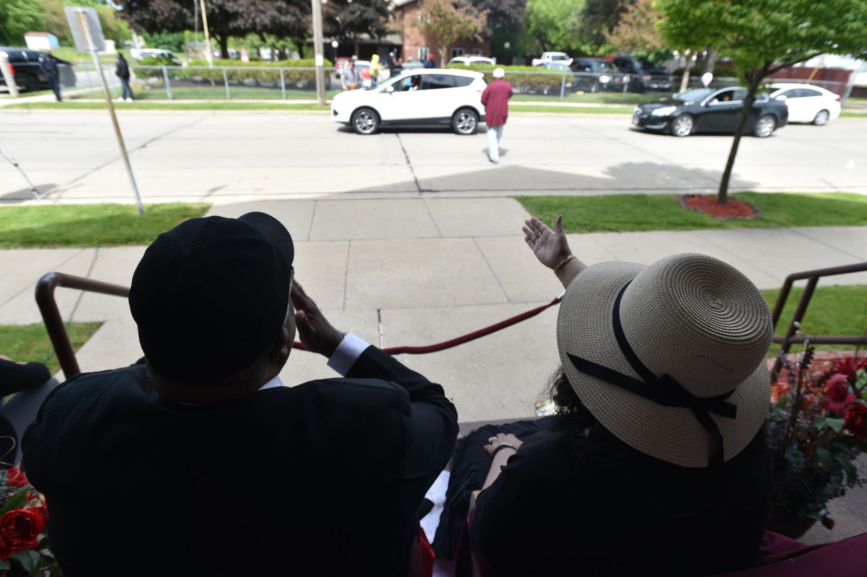 Rev. Bishop Kirby blows kisses while Dr. Renee Kirby waves